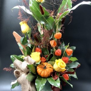 Σύνθεση λουλουδιών σε φθινοπωρινές σε κυλινδρικό βάζο glaze
